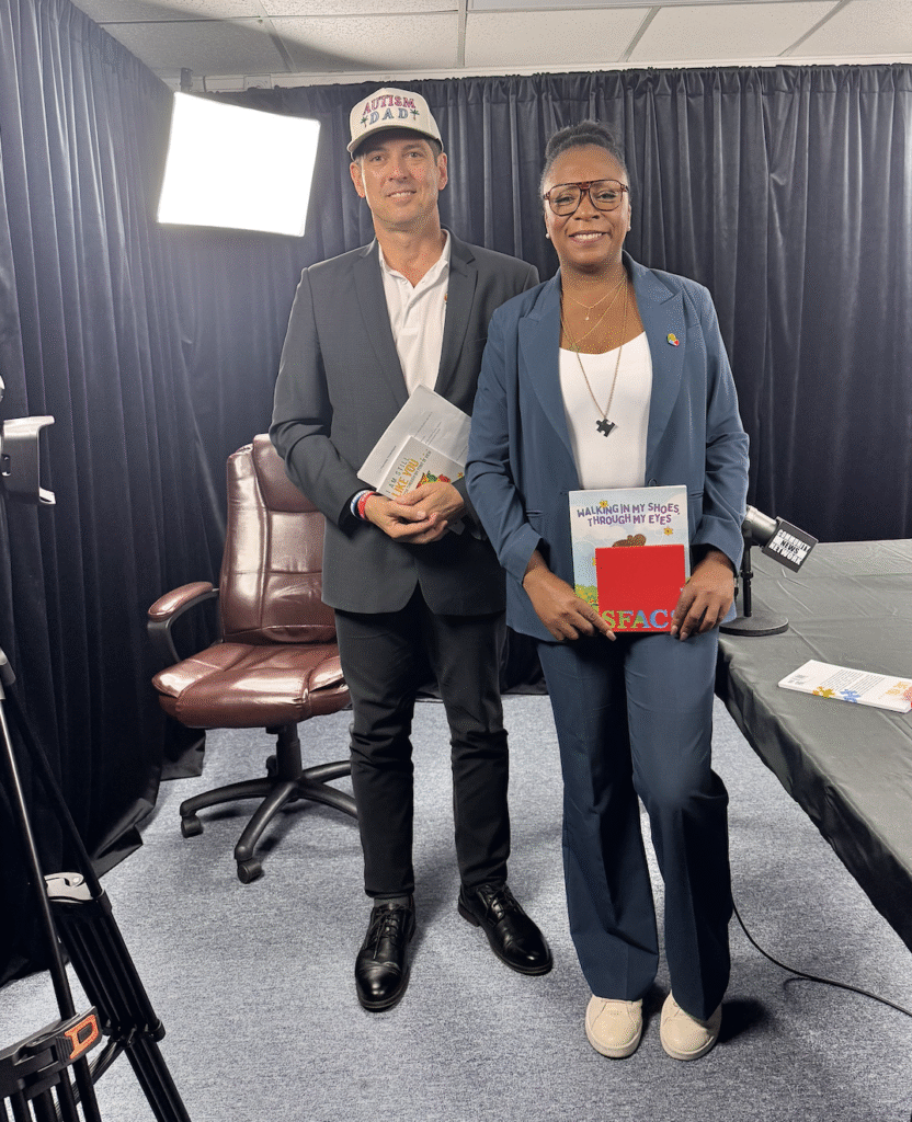 Smiling co-founder of South Florida Autism Charter School standing with Miami Autism Dad Victor Antunez.