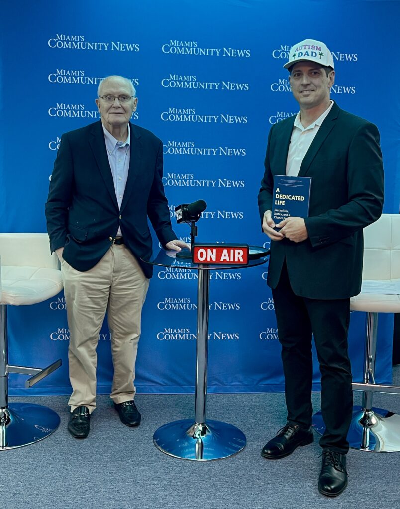 David Lawrence Jr. Founder and Chair of The Children's Movement standing for a photo with Miami Autism Dad Victor Antunez.