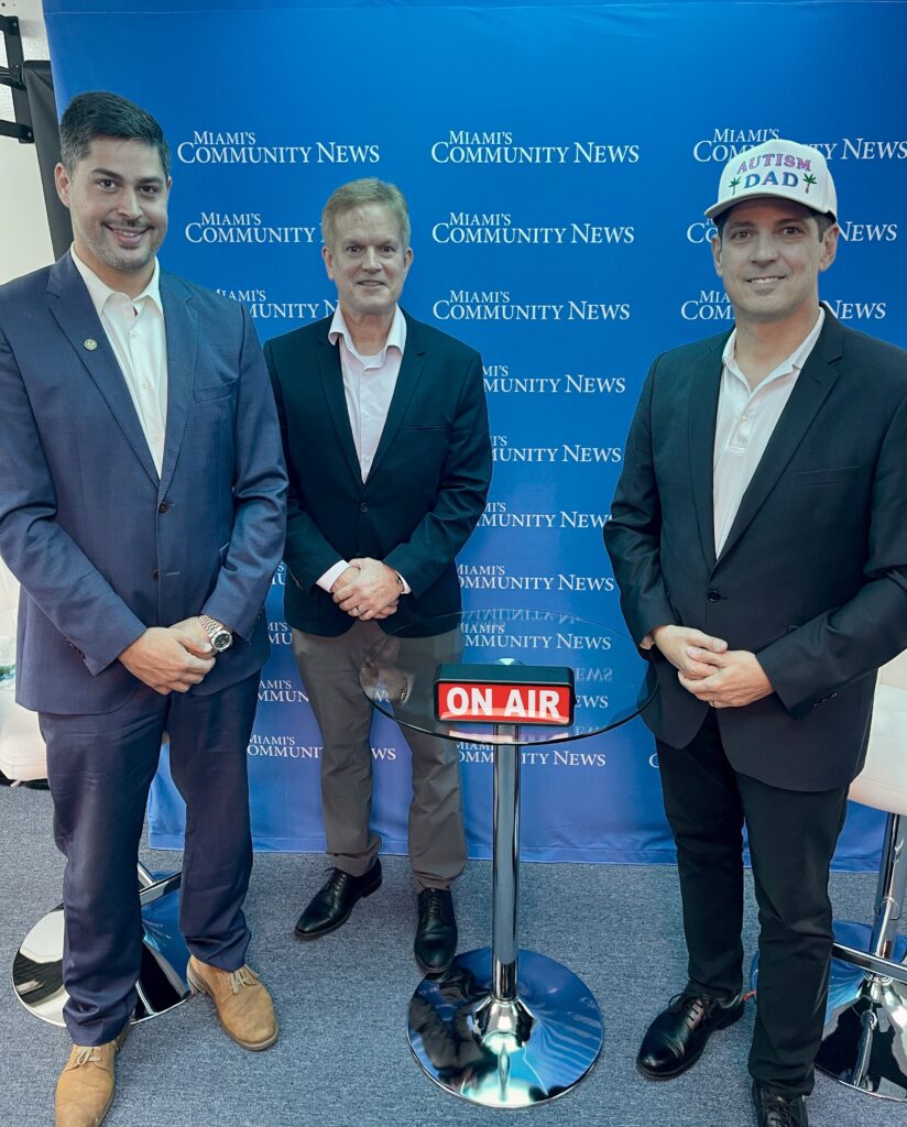 Certified Financial Planner's Steve Clark & Nelson Maldonado pose for a photo with Miami Autism Dad Victor Antunez.