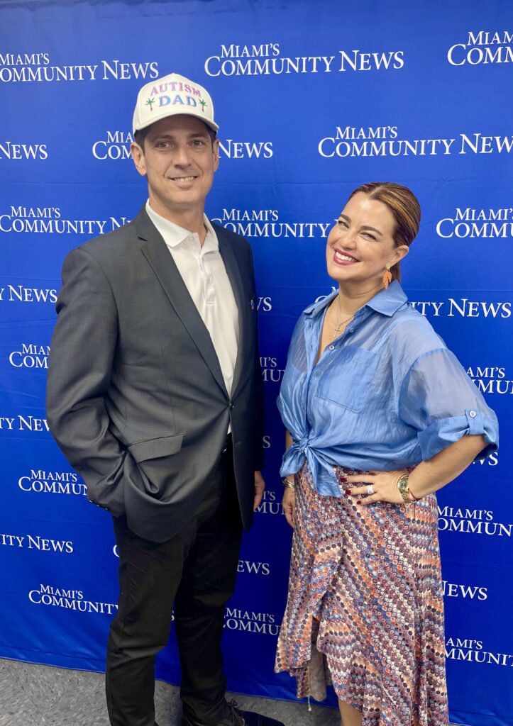 Yolanda Carvajal of the BEELIVER Cancer Research Foundation and Miami Autism Dad Victor Antunez smiling for an in studio photo.